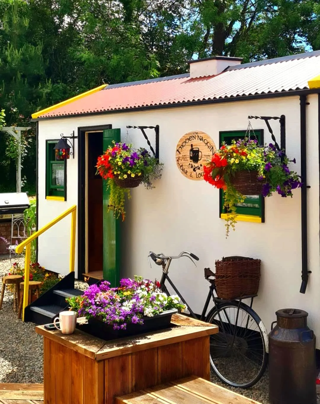 The Hidden Naggin exterior with hanging flower baskets