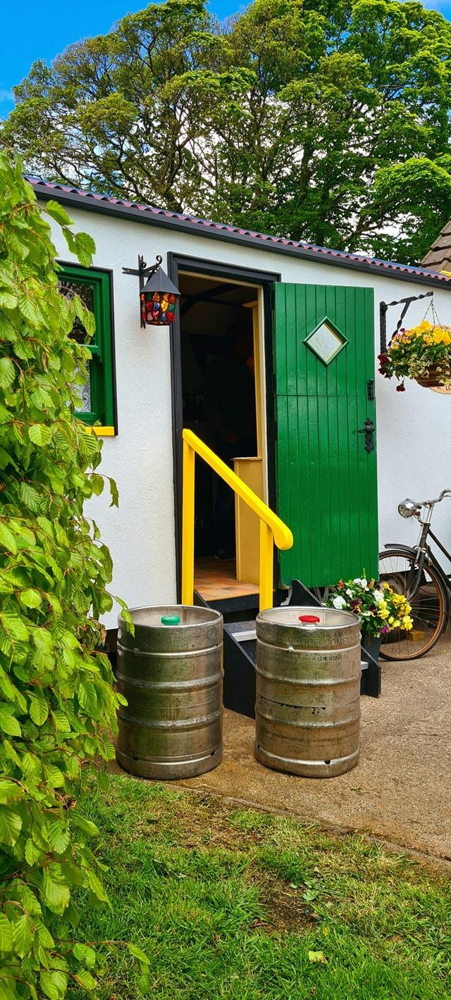 The Hidden Naggin exterior with beer kegs