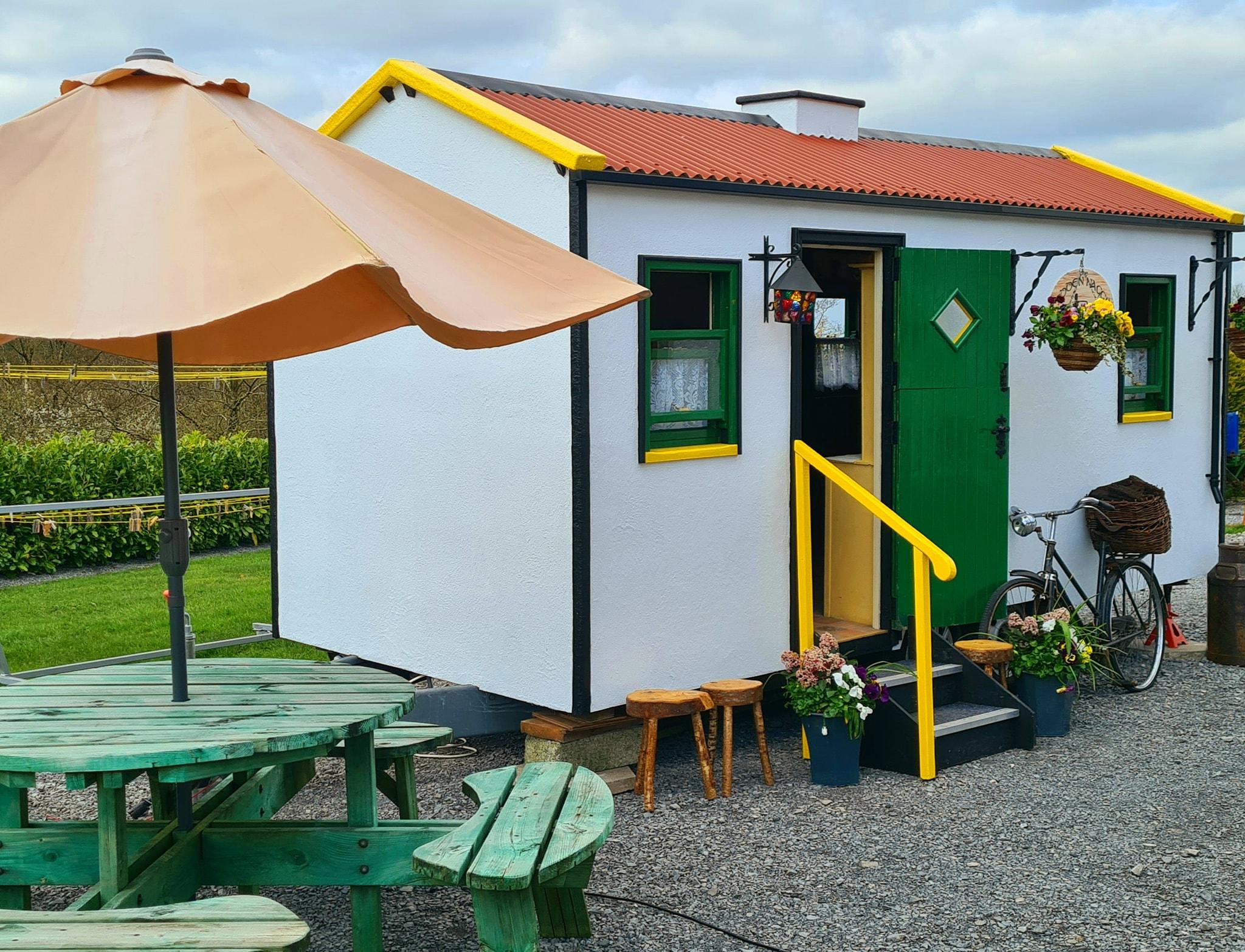 The Hidden Naggin set up with outdoor seating and umbrella