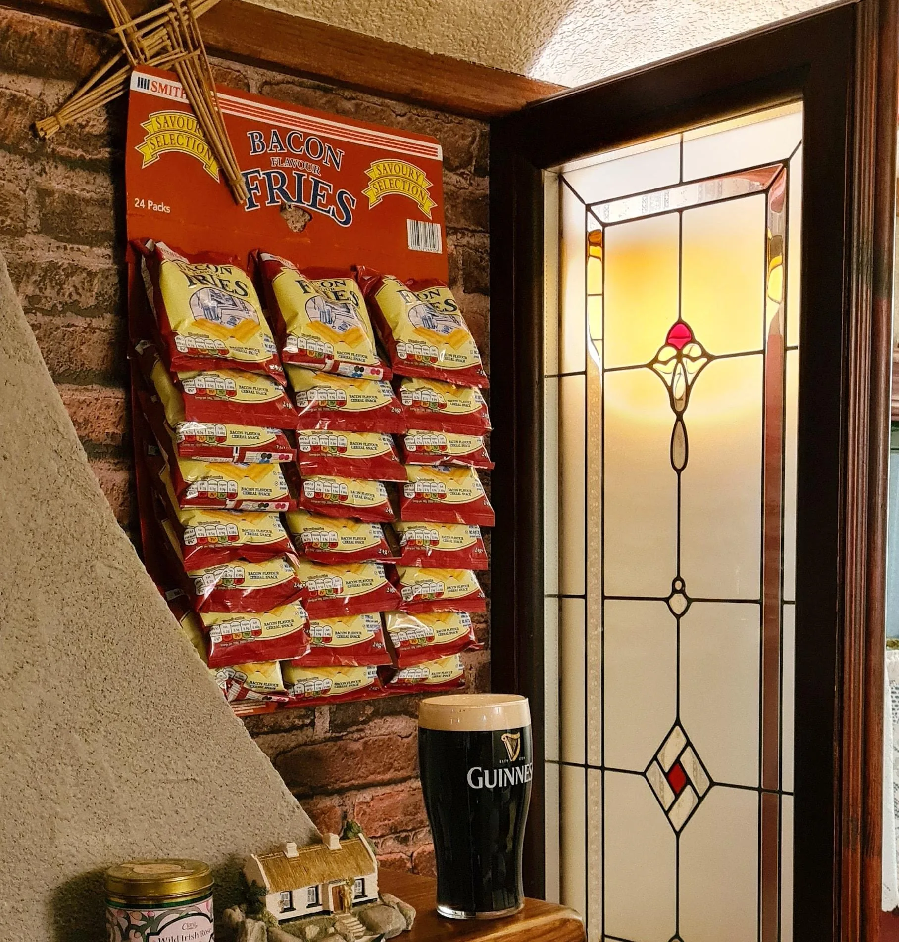 Bar detail inside The Hidden Naggin with Guinness pint