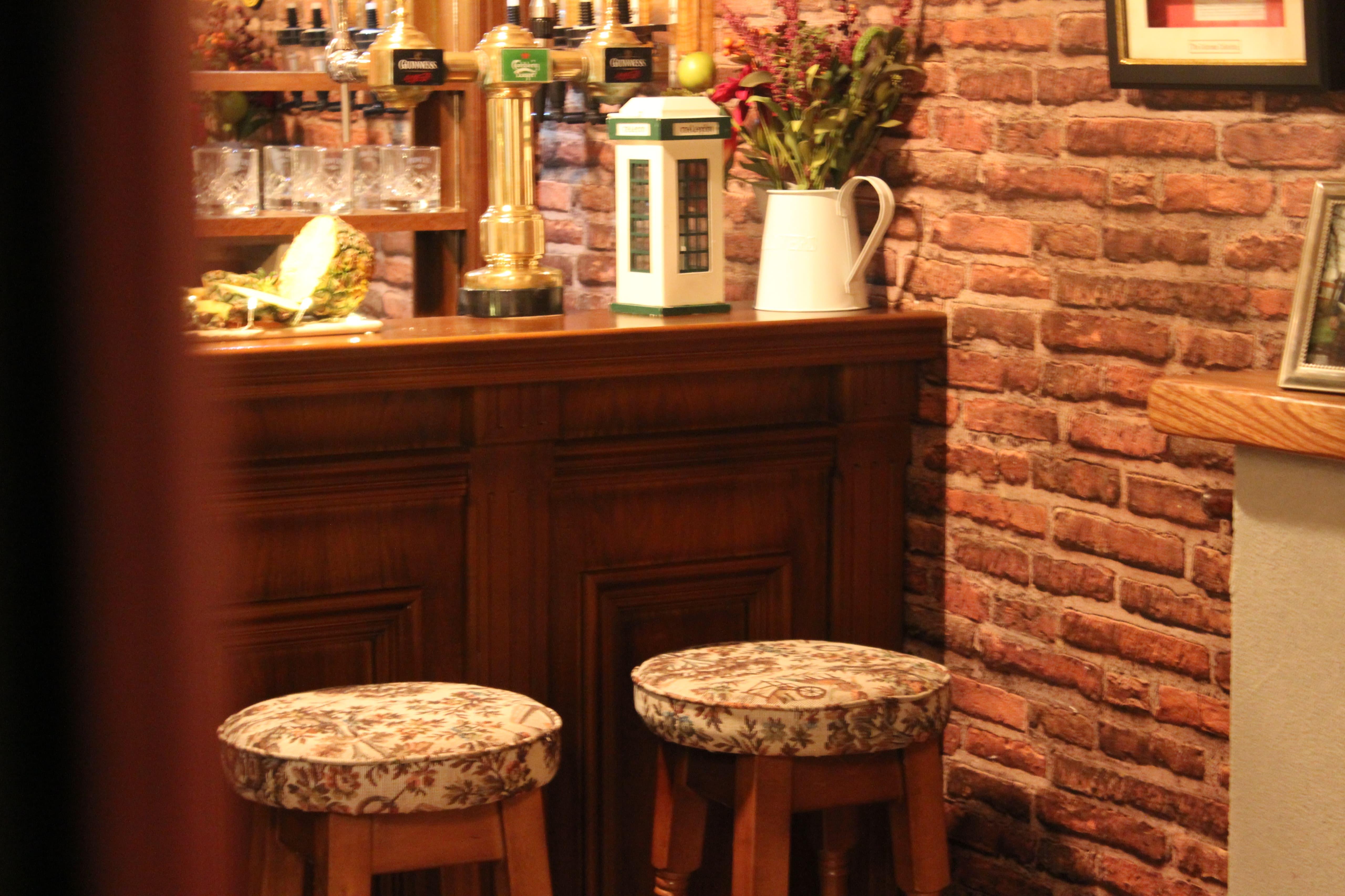 Bar counter and stool detail inside The Hidden Naggin