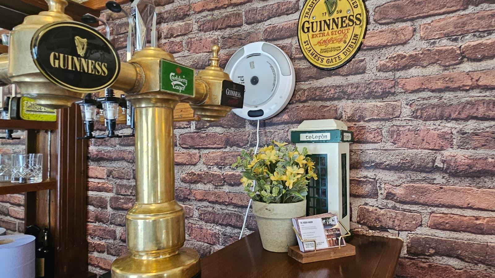 Beer tap and brick wall detail at the bar