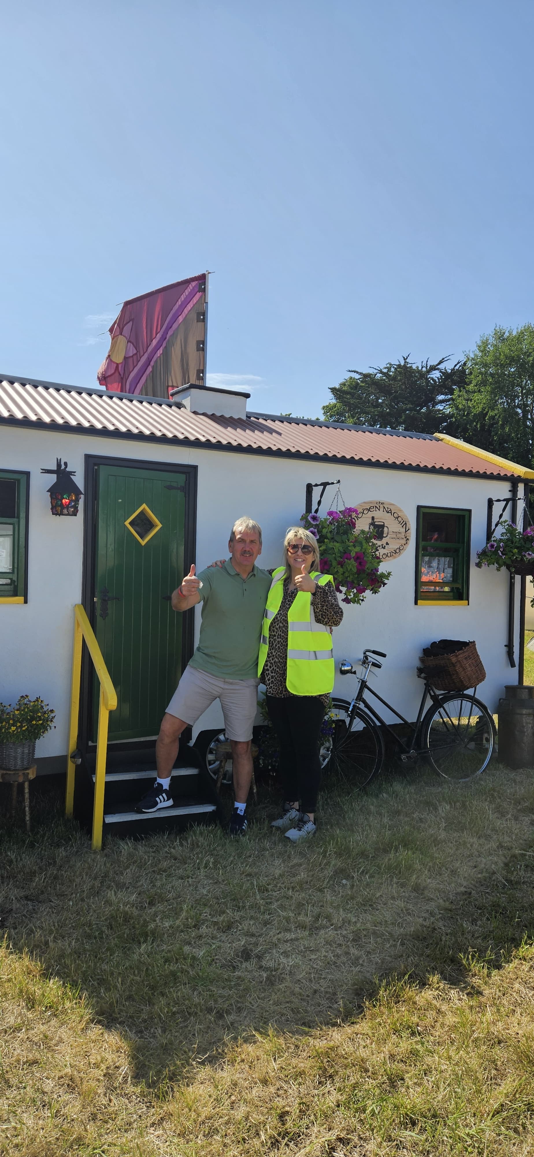 Guests giving thumbs up outside The Hidden Naggin