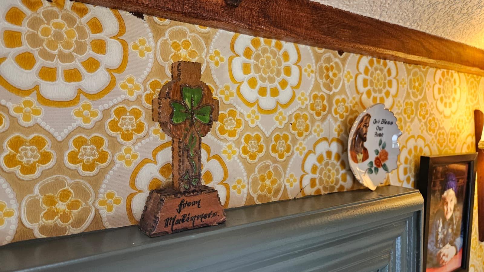 Cross and plate detail on the interior shelf