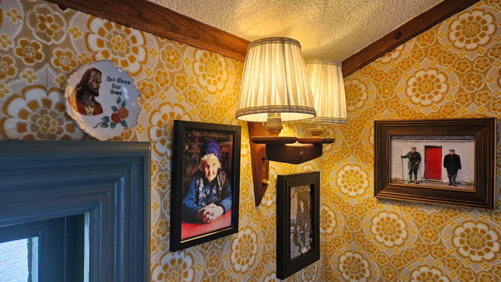 Lamps and framed photos on the interior wall