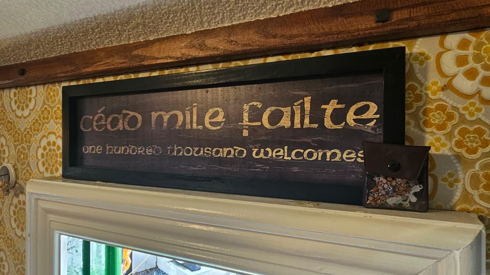 Cead mile failte sign inside The Hidden Naggin